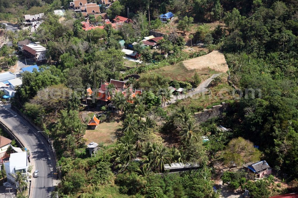 Aerial photograph Patong - Outskirts of the city of Patong on Phuket Island in Thailand with traditional houses with palm trees