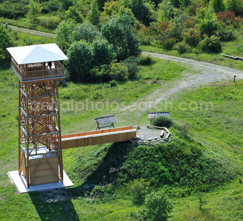 Eisenach from the bird's eye view: Der 2011 neu errichtete Aussichtsturm Hainich-Blick ist eine 20 Meter hohe Holzkonstruktion, für die nur einheimische Nutzholzarten verwendet wurden. Er steht bei Hütscheroda in der Nähe von Eisenach in Thüringen am Wildkatzenpfad im Nationalpark Hainich, welcher zum UNESCO-Weltnaturerbe gehört, und dient zur Orientierung im südlichen Offengelände des Parkes. 2011 newly raised viewing tower Hainich-Blick is a 20 metres high wood construction, for which solely domestic timber was used. It is located close to Hütscheroda near city Eisenach in Thuringia at Wildkatzenpfad of Hainich National Park, which ranks among UNESCO World Heritage - natural site. The tower serves for the orientation in southern parts of the park.