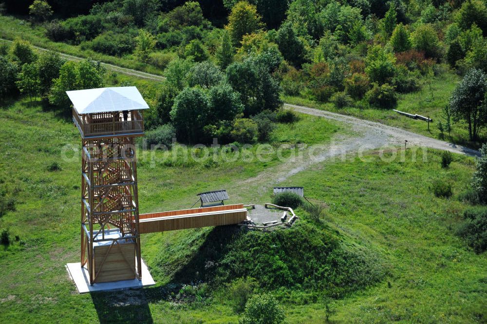 Aerial image Eisenach - Der 2011 neu errichtete Aussichtsturm Hainich-Blick ist eine 20 Meter hohe Holzkonstruktion, für die nur einheimische Nutzholzarten verwendet wurden. Er steht bei Hütscheroda in der Nähe von Eisenach in Thüringen am Wildkatzenpfad im Nationalpark Hainich, welcher zum UNESCO-Weltnaturerbe gehört, und dient zur Orientierung im südlichen Offengelände des Parkes. 2011 newly raised viewing tower Hainich-Blick is a 20 metres high wood construction, for which solely domestic timber was used. It is located close to Hütscheroda near city Eisenach in Thuringia at Wildkatzenpfad of Hainich National Park, which ranks among UNESCO World Heritage - natural site. The tower serves for the orientation in southern parts of the park.