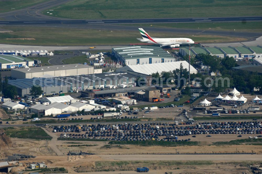 Schönefeld from the bird's eye view: Blick auf das Ausstellungsgelände der Internationalen Luftfahrtshow ILA 2010 auf dem Gelände des Flughafen Berlin-Schönefeld wenige Minuten vor der Eröffnung. View of the exhibition grounds of the International Air Show ILA 2010 on the grounds of the airport Berlin-Schönefeld few minutes before the opening.