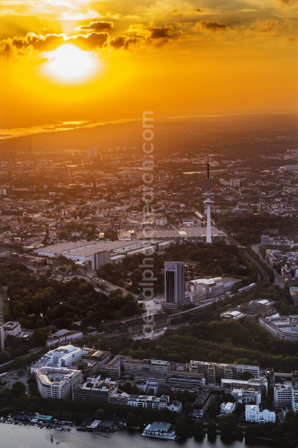 Hamburg from above - Exhibition grounds and exhibition halls of the Neue Messe at the broadcasting tower at sunset Heinrich-Hertz-Turm in Hamburg, Germany