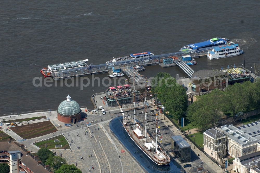 Aerial photograph London - View of the exhibition area with the glass of dry English tea and wool clipper / sailing ship Cutty Sark in London. The Cutty Sark is an English tea and wool clipper. It was completed in 1869 and was one of the fastest sailing ships of their time