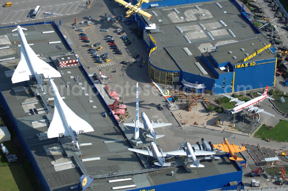 Sinsheim from the bird's eye view: Auto & Technik Museum Sinsheim. Auf 30.000 qm Hallenfläche befinden sich hier mehr als 3.000 Exponate, darunter die Concorde der Air France,die russische TU-144, Oldtimer, Flugzeuge, Formel-1-Wagen, Motorräder und Lokomotiven. Auf dem Gelände ist auch das IMAX 3D Filmtheater. Kontakt: Auto & Technik MUSEUM SINSHEIM / IMAX 3D Filmtheater, Museumsplatz, D-74889 Sinsheim, Tel.: 0049 (0) 7261 / 9299-0, Fax: 0049 (0) 7261 / 13916,