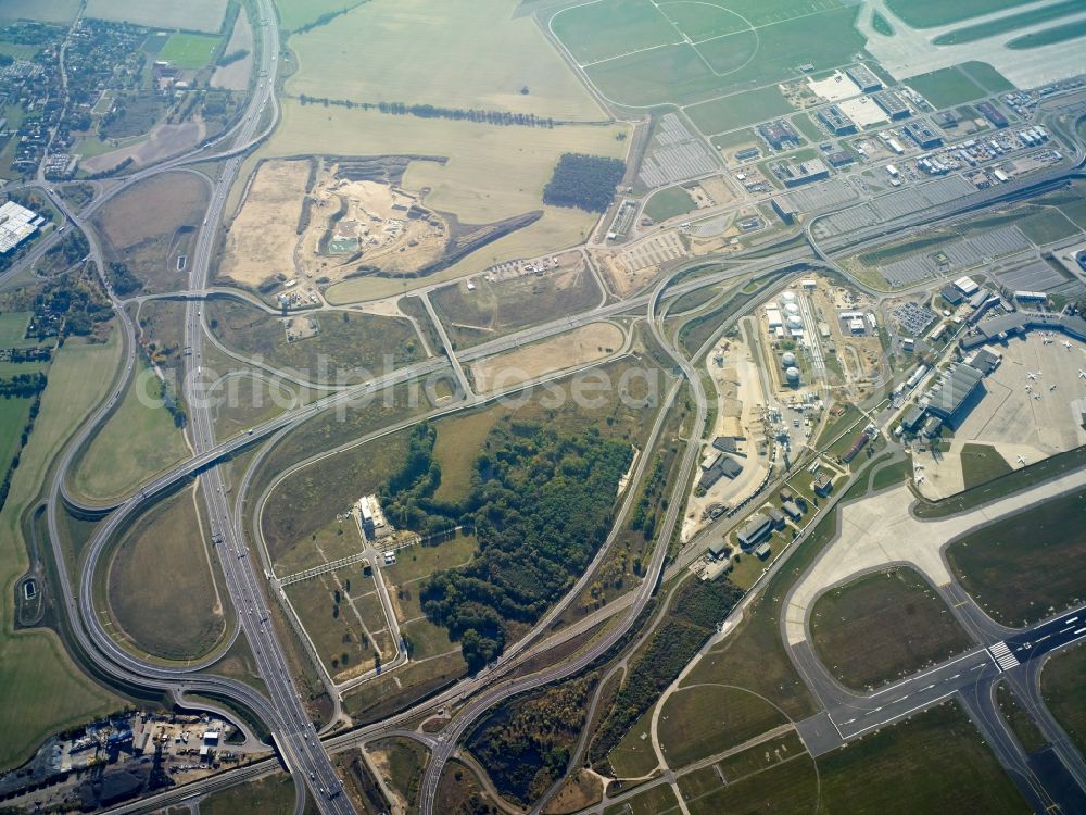 Schönefeld from above - Routing and traffic lanes at the exit and access (Anschlussstelle) at the BER airport of the motorway A113 in Schoenefeld in the state of Brandenburg