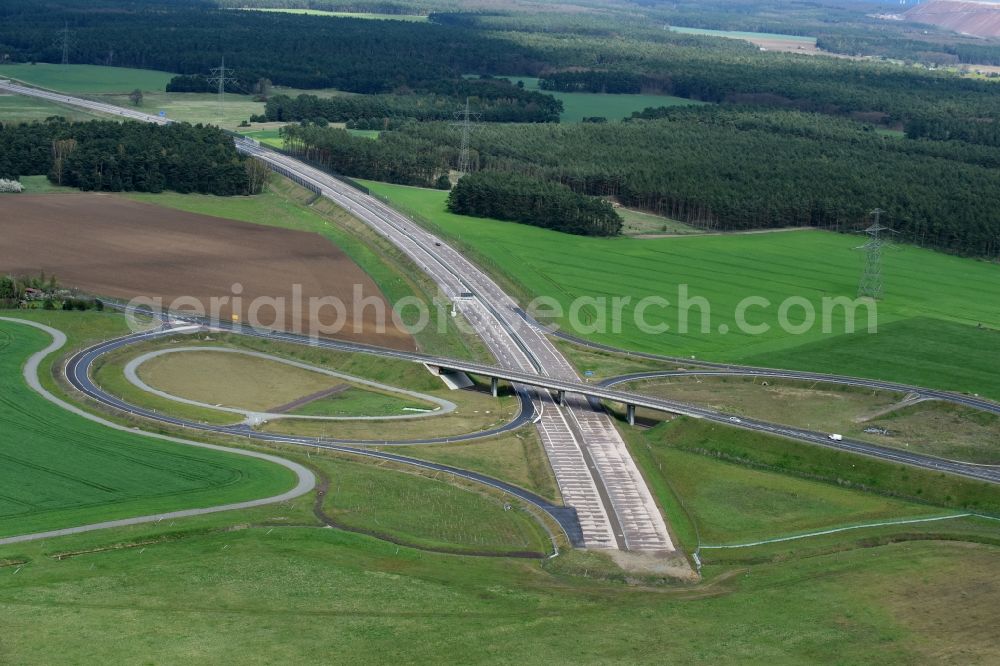 Colbitz from the bird's eye view: Routing and traffic lanes during the highway exit and access the motorway A 14 zu B189 in Colbitz in the state Saxony-Anhalt