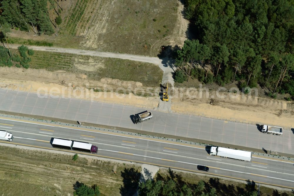 Aerial image Friedrichshof - Routing and traffic lanes during the highway exit and access the motorway A 12 E30 in Friedrichshof in the state Brandenburg