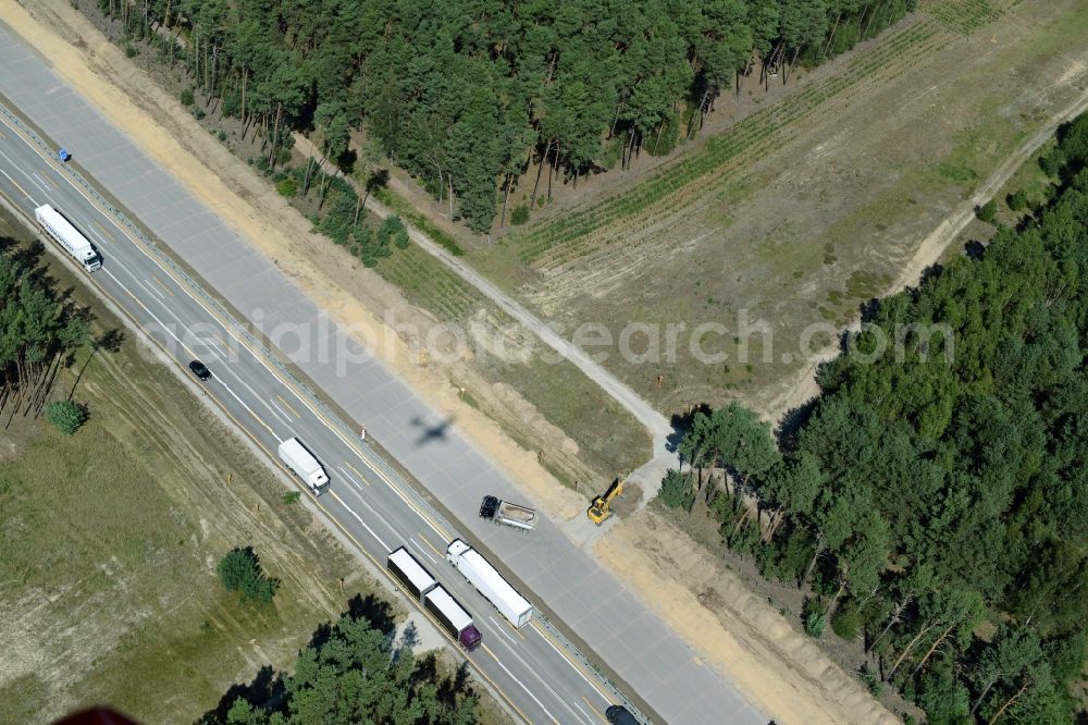 Aerial photograph Friedrichshof - Routing and traffic lanes during the highway exit and access the motorway A 12 E30 in Friedrichshof in the state Brandenburg