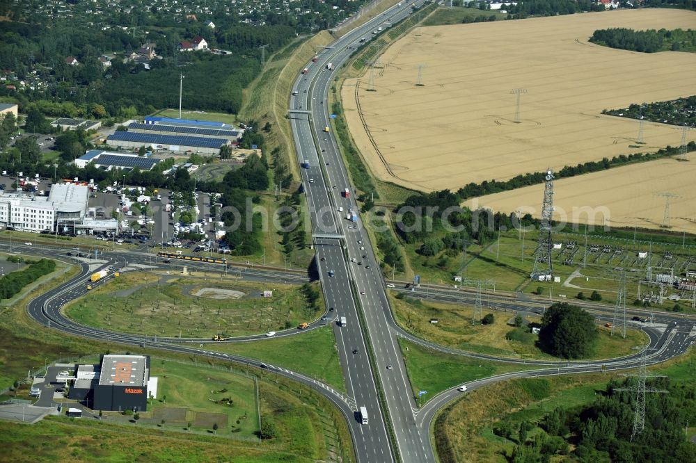 Taucha from the bird's eye view: Routing and traffic lanes during the highway exit and access the motorway A 14 Leipzig-Nordost destrict Paunsdorf in Taucha in the state Saxony