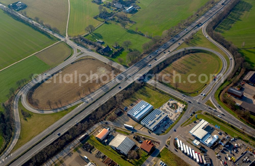 Isselburg from the bird's eye view: Routing and traffic lanes during the highway exit and access the motorway A 3 in Isselburg in the state North Rhine-Westphalia