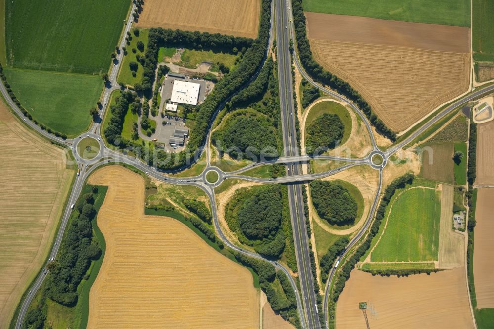 Jülich from above - Routing and traffic lanes during the highway exit and access the motorway A 44 to the Landstrasse L14 in Juelich in the state North Rhine-Westphalia, Germany