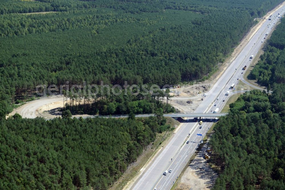 Friedrichshof from above - Routing and traffic lanes during the highway exit and access the motorway A 12 E30 in Friedrichshof in the state Brandenburg