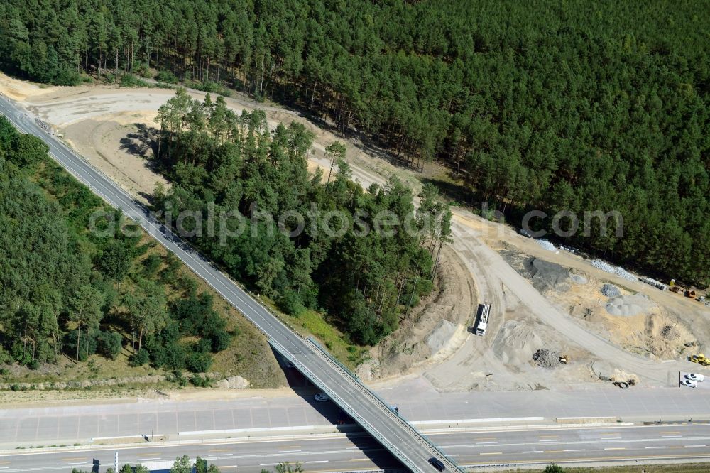 Friedrichshof from the bird's eye view: Routing and traffic lanes during the highway exit and access the motorway A 12 E30 in Friedrichshof in the state Brandenburg