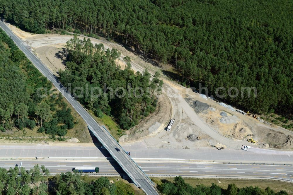 Aerial image Friedrichshof - Routing and traffic lanes during the highway exit and access the motorway A 12 E30 in Friedrichshof in the state Brandenburg