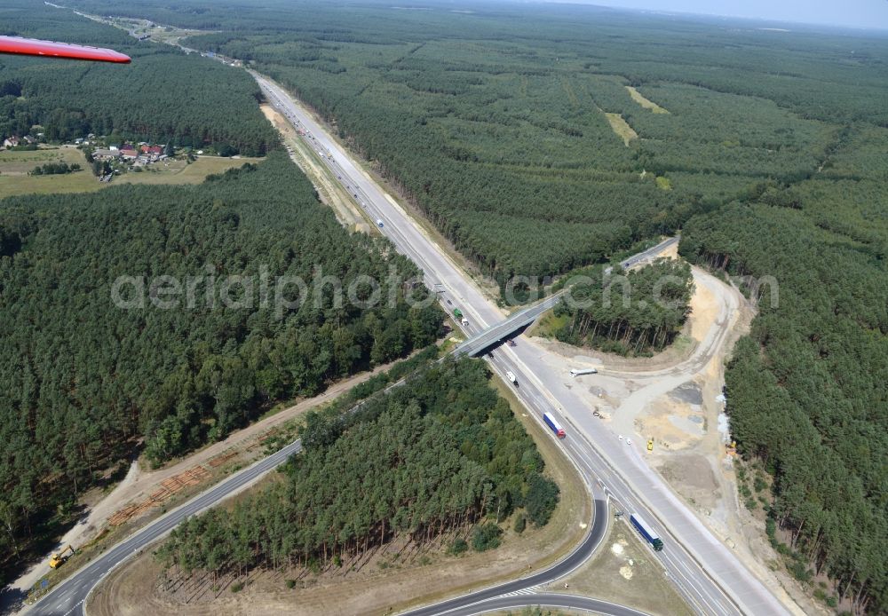 Aerial photograph Friedrichshof - Routing and traffic lanes during the highway exit and access the motorway A 12 E30 in Friedrichshof in the state Brandenburg