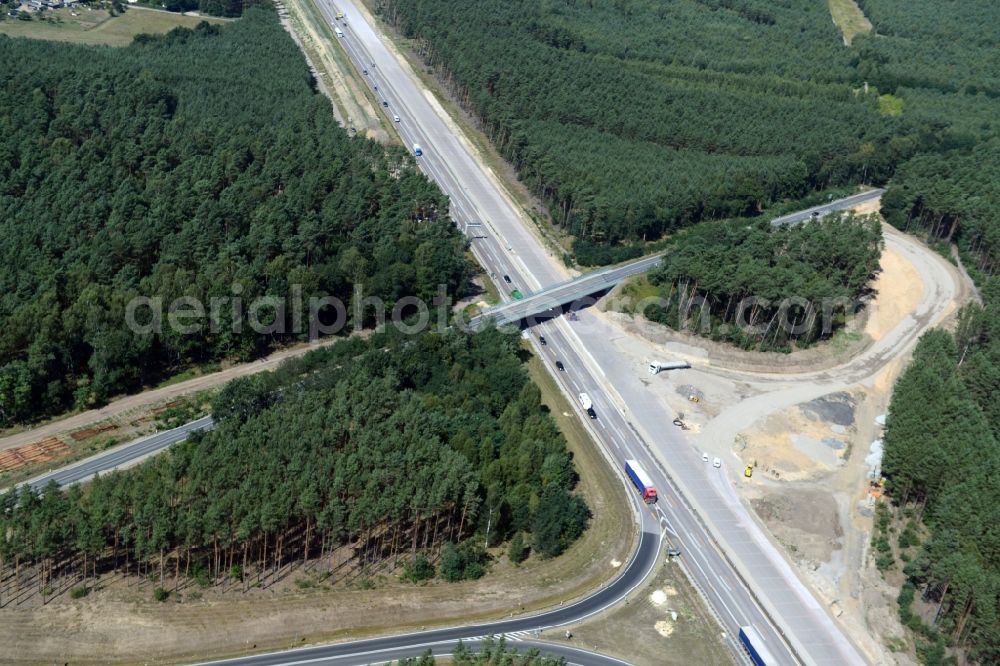 Friedrichshof from above - Routing and traffic lanes during the highway exit and access the motorway A 12 E30 in Friedrichshof in the state Brandenburg