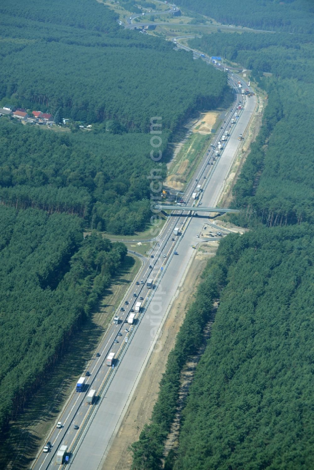 Friedrichshof from the bird's eye view: Routing and traffic lanes during the highway exit and access the motorway A 12 E30 in Friedrichshof in the state Brandenburg