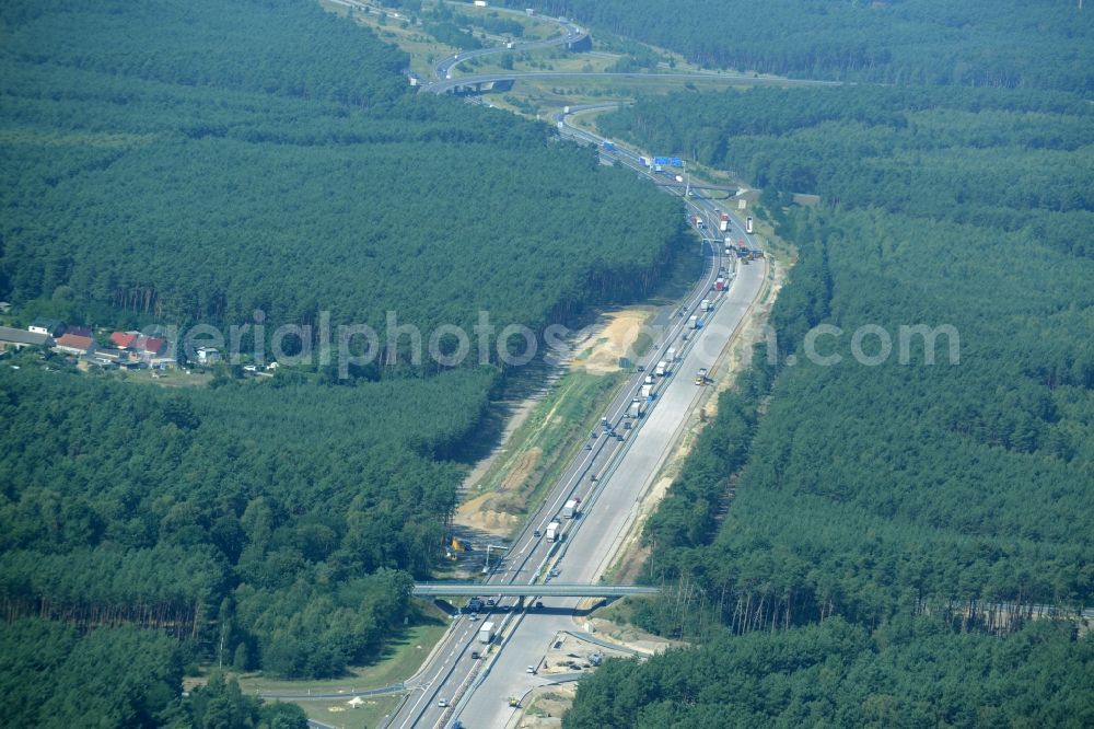 Aerial image Friedrichshof - Routing and traffic lanes during the highway exit and access the motorway A 12 E30 in Friedrichshof in the state Brandenburg