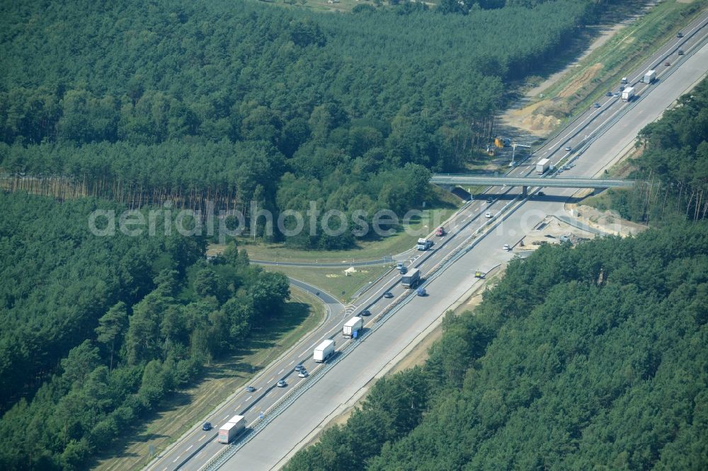 Aerial photograph Friedrichshof - Routing and traffic lanes during the highway exit and access the motorway A 12 E30 in Friedrichshof in the state Brandenburg