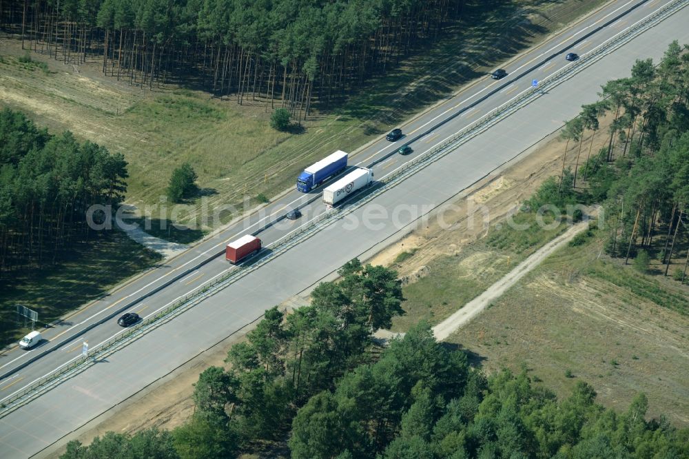 Friedrichshof from above - Routing and traffic lanes during the highway exit and access the motorway A 12 E30 in Friedrichshof in the state Brandenburg