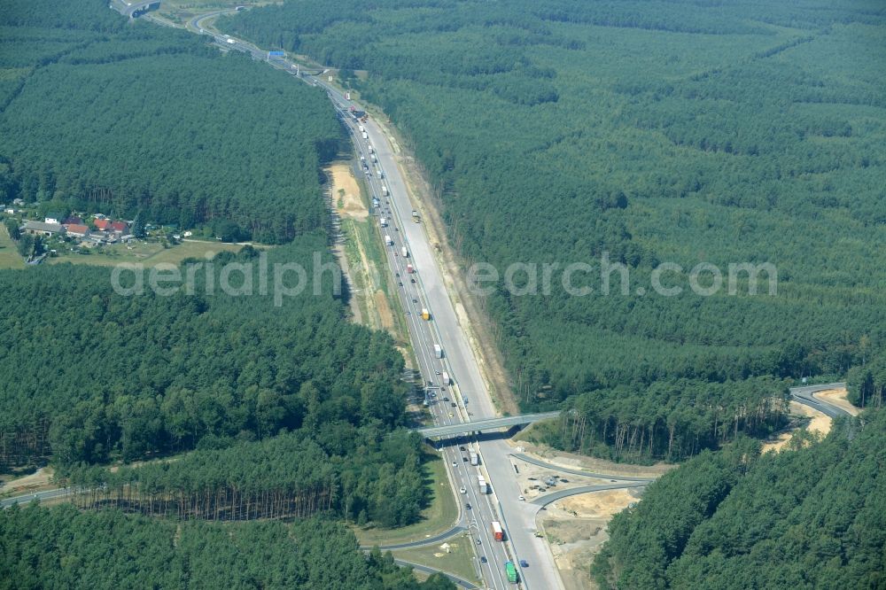 Aerial image Friedrichshof - Routing and traffic lanes during the highway exit and access the motorway A 12 E30 in Friedrichshof in the state Brandenburg