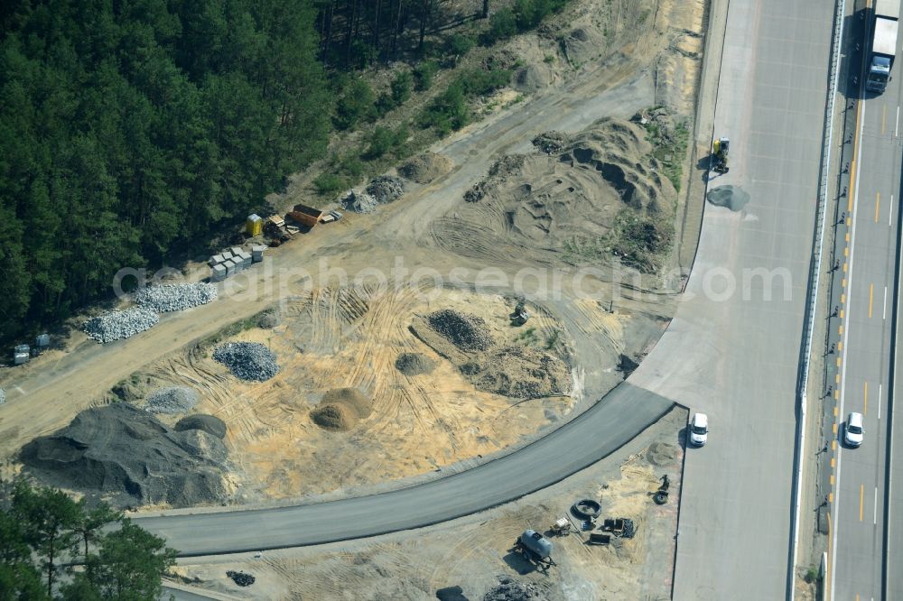 Friedrichshof from above - Routing and traffic lanes during the highway exit and access the motorway A 12 E30 in Friedrichshof in the state Brandenburg