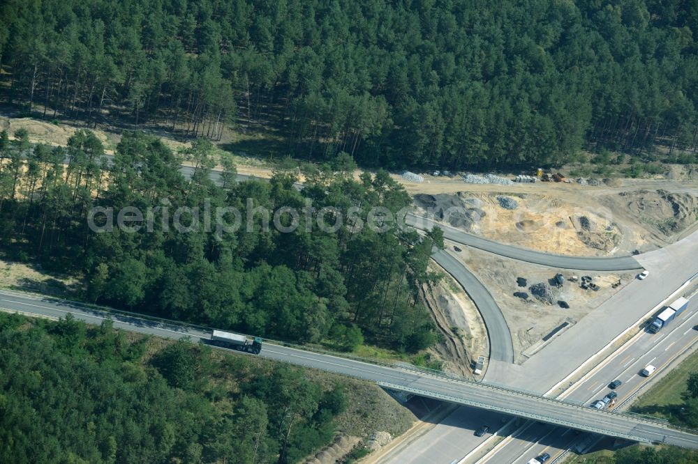 Aerial image Friedrichshof - Routing and traffic lanes during the highway exit and access the motorway A 12 E30 in Friedrichshof in the state Brandenburg