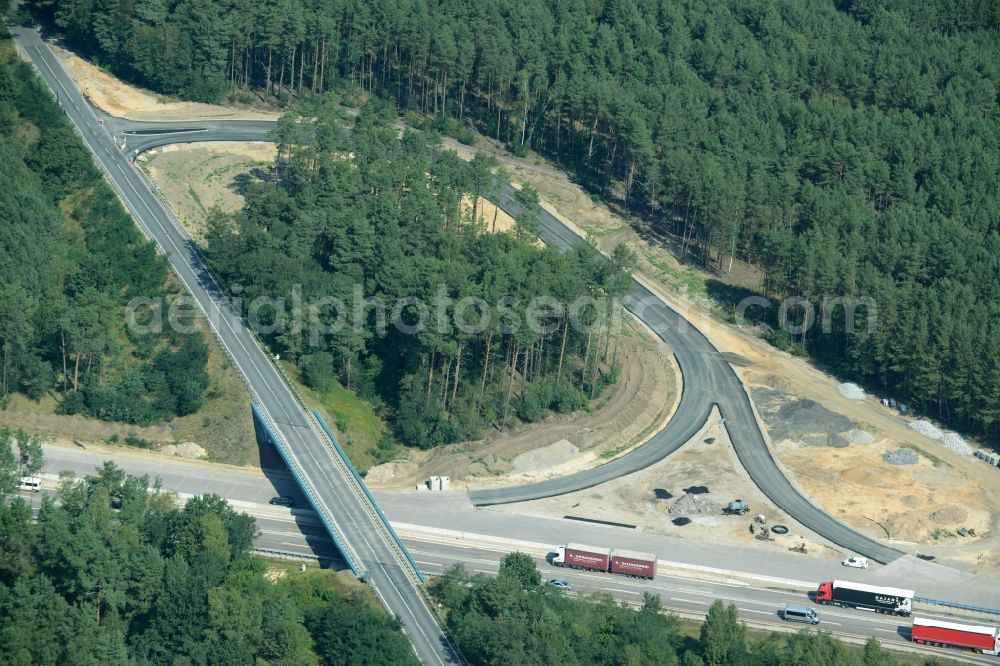 Aerial photograph Friedrichshof - Routing and traffic lanes during the highway exit and access the motorway A 12 E30 in Friedrichshof in the state Brandenburg