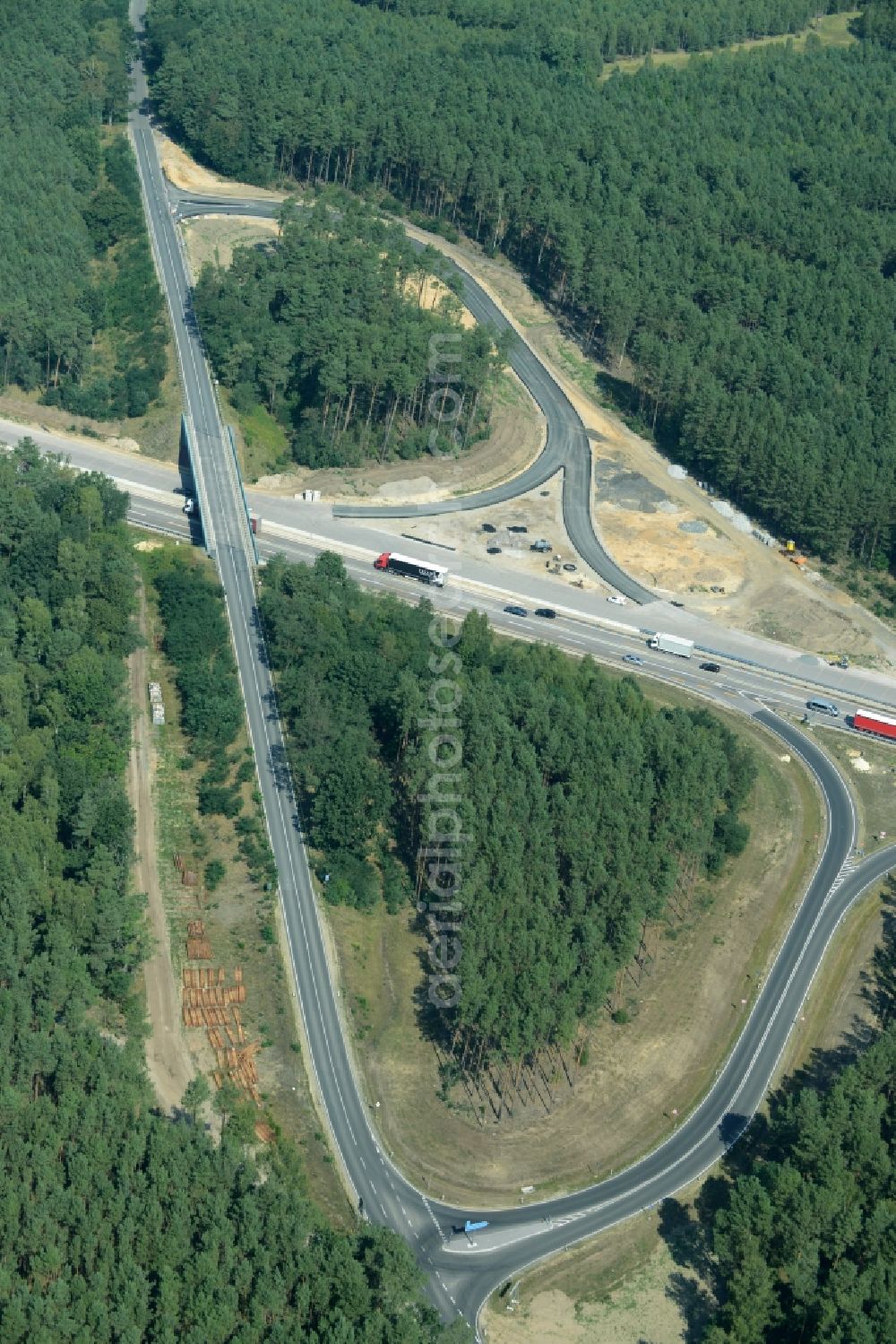 Friedrichshof from above - Routing and traffic lanes during the highway exit and access the motorway A 12 E30 in Friedrichshof in the state Brandenburg