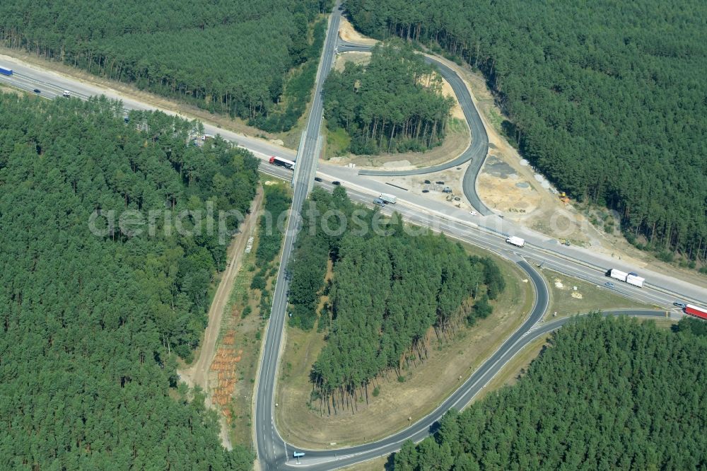 Friedrichshof from the bird's eye view: Routing and traffic lanes during the highway exit and access the motorway A 12 E30 in Friedrichshof in the state Brandenburg