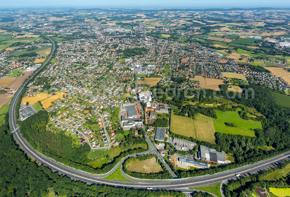 Bünde from the bird's eye view: Routing and traffic lanes during the highway exit and access Hiddenhausen of the motorway A 30 in Buende in the state North Rhine-Westphalia