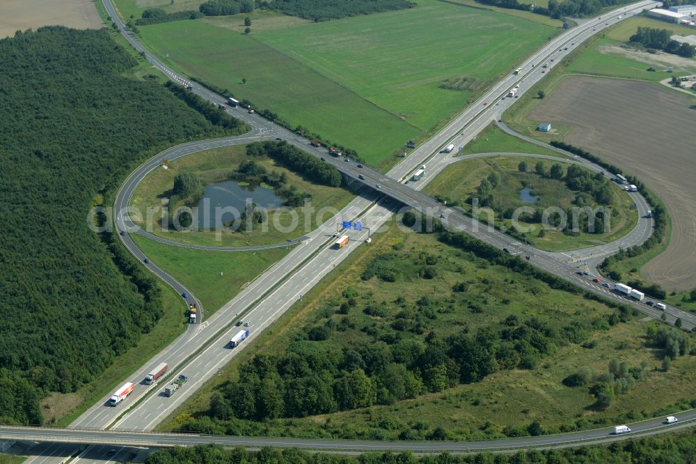 Leipzig from above - Routing and traffic lanes during the highway exit Leipzig-Ost and access the motorway A 14 in Leipzig in the state of Saxony. A small pond is located in the interchange that connects the federal motorway with the B6 federal highway