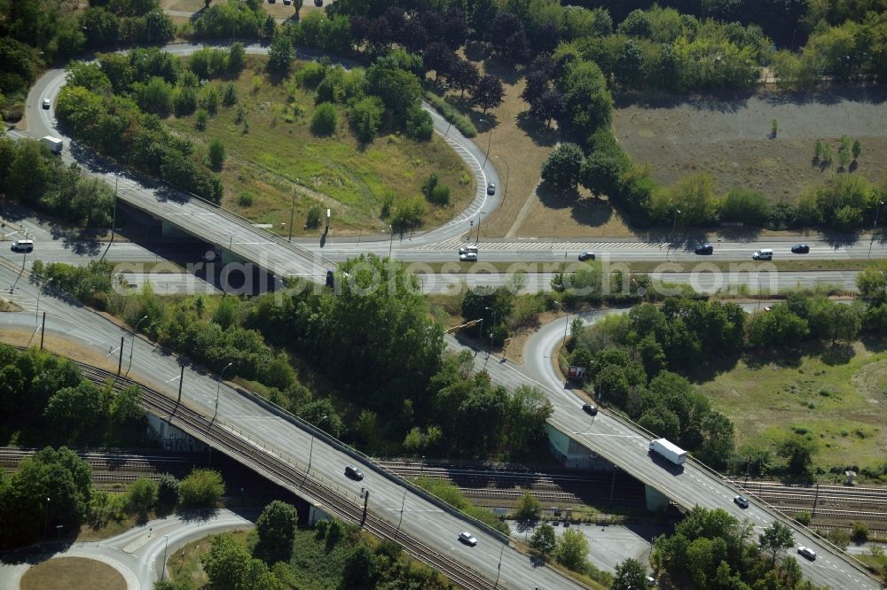 Berlin from above - Routing and traffic lanes during the highway exit and access the motorway Maerkischen Allee in Berlin in Germany