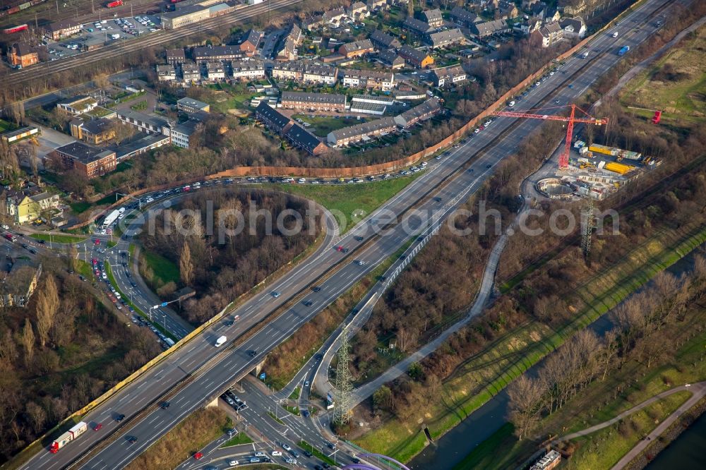 Aerial image Oberhausen - Routing and traffic lanes during the highway exit and access Neue Mitte of the motorway A 42 in autumnal Oberhausen in the state North Rhine-Westphalia