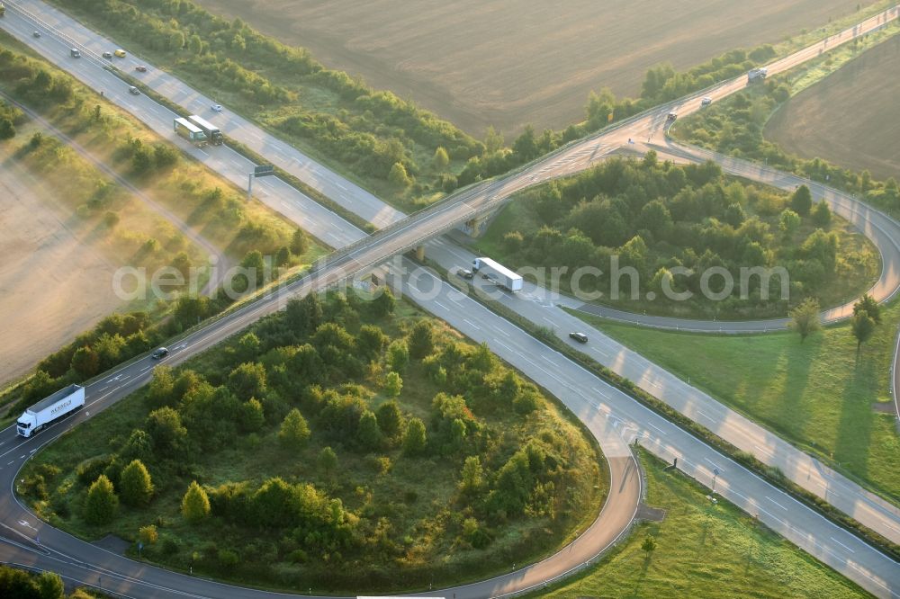 Nienburg (Saale) from the bird's eye view: Routing and traffic lanes during the highway exit and access the motorway A 14 in Nienburg (Saale) in the state Saxony-Anhalt, Germany