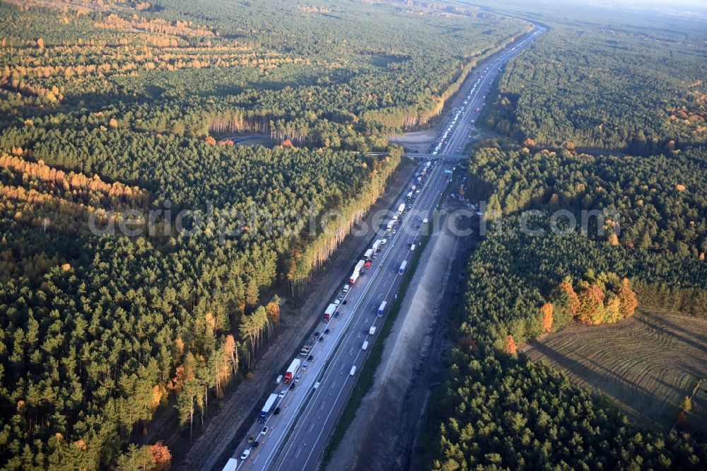 Dannenreich from the bird's eye view: Highway construction site for the expansion and extension of track along the route of A12 E30 an der Abfahrt Fredersdorf in Dannenreich in the state Brandenburg