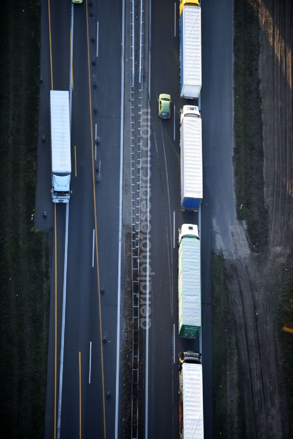 Spreenhagen from the bird's eye view: Highway construction site for the expansion and extension of track along the route of A12 E30 an unterschiedlichen Fahrbahn- Belag- Anschlussstellen in Spreenhagen in the state Brandenburg