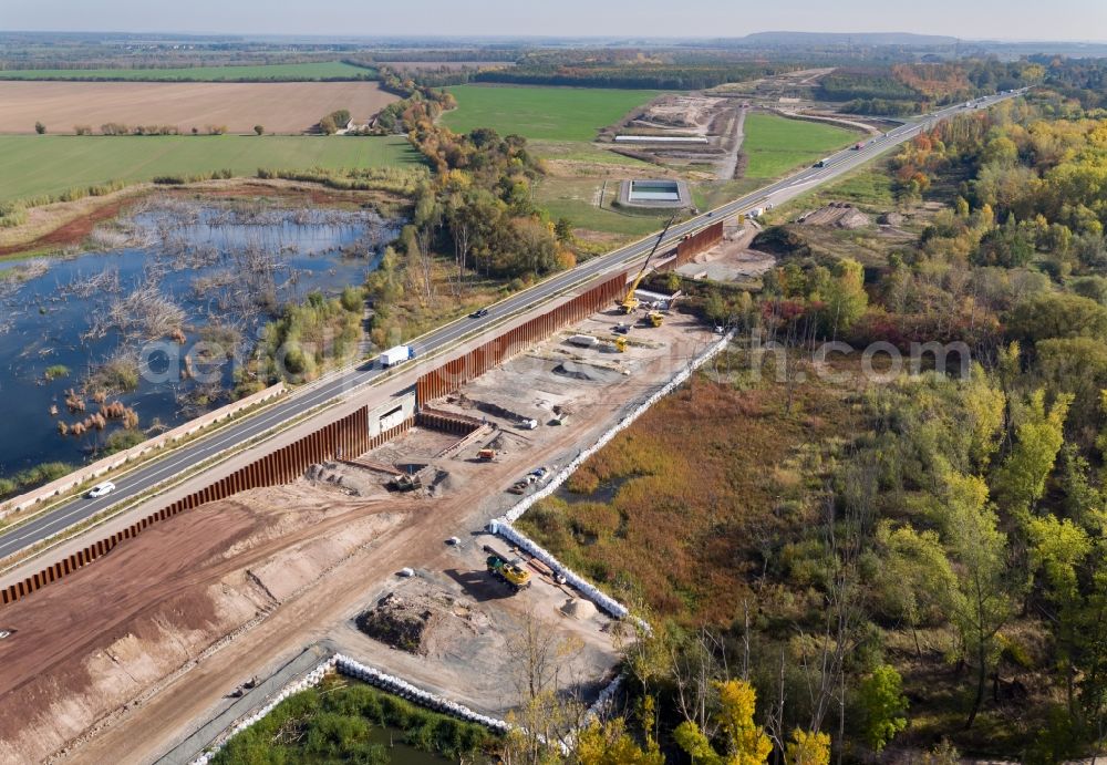 Aerial image Rötha - Motorway- Construction site with earthworks along the route and of the route of the highway of BAB A72 in Roetha in the state Saxony, Germany