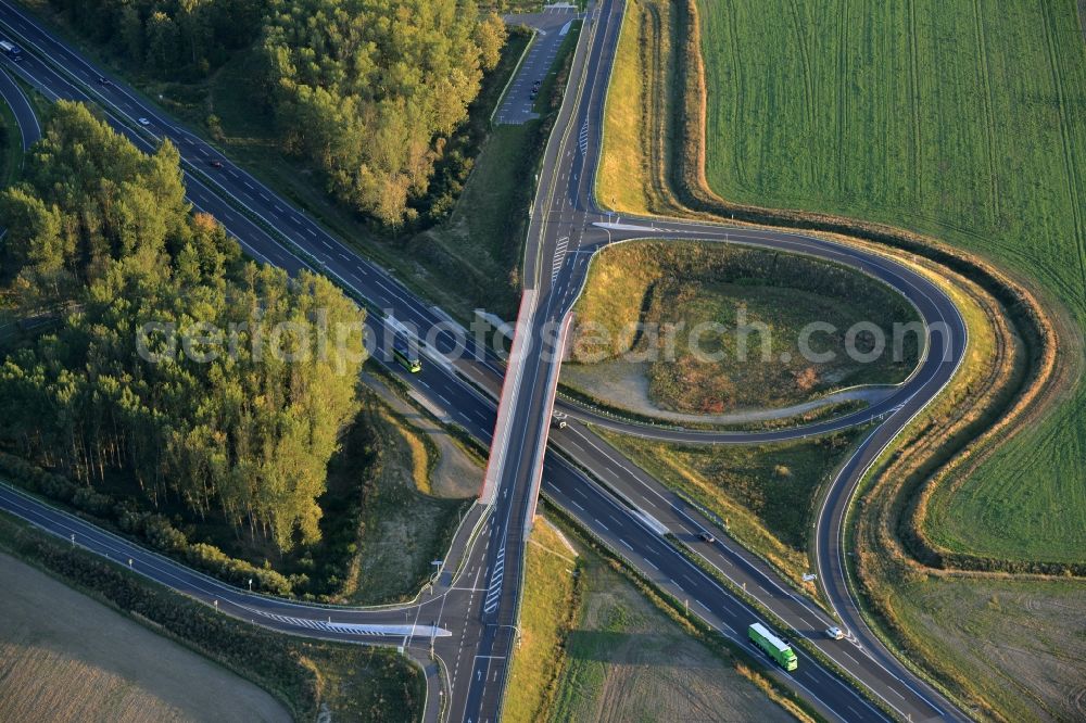 Aerial photograph Fehrbellin - Routing and traffic lanes over the highway bridge in the motorway A at the exit Neuruppin-Sued in Fehrbellin in the state Brandenburg