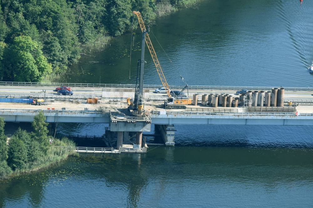 Petersdorf from the bird's eye view: Routing and traffic lanes over the highway bridge in the motorway A 19 and new construction site in Petersdorf in the state Mecklenburg - Western Pomerania