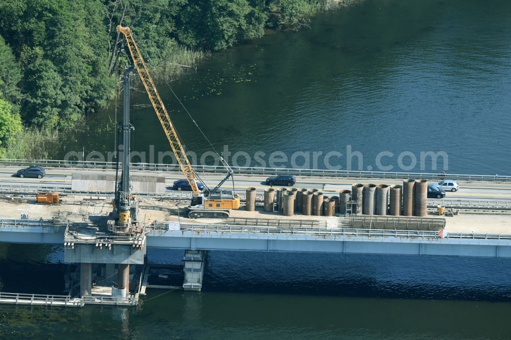 Aerial image Petersdorf - Routing and traffic lanes over the highway bridge in the motorway A 19 and new construction site in Petersdorf in the state Mecklenburg - Western Pomerania