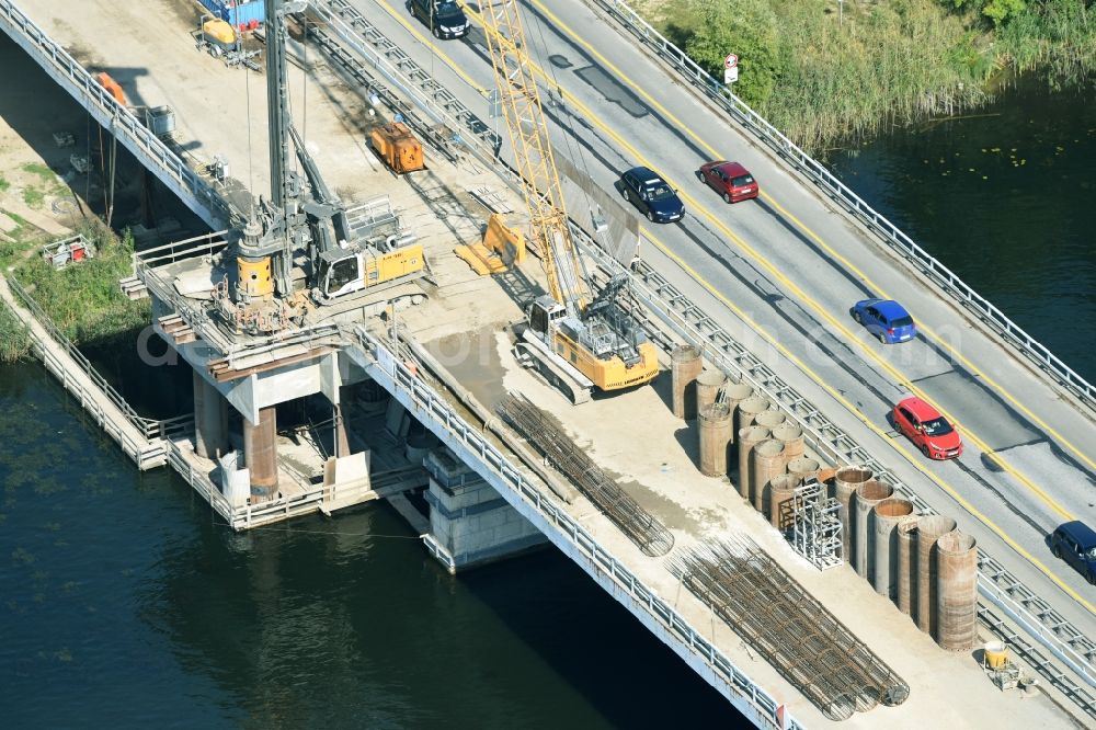 Aerial image Petersdorf - Routing and traffic lanes over the highway bridge in the motorway A 19 and new construction site in Petersdorf in the state Mecklenburg - Western Pomerania