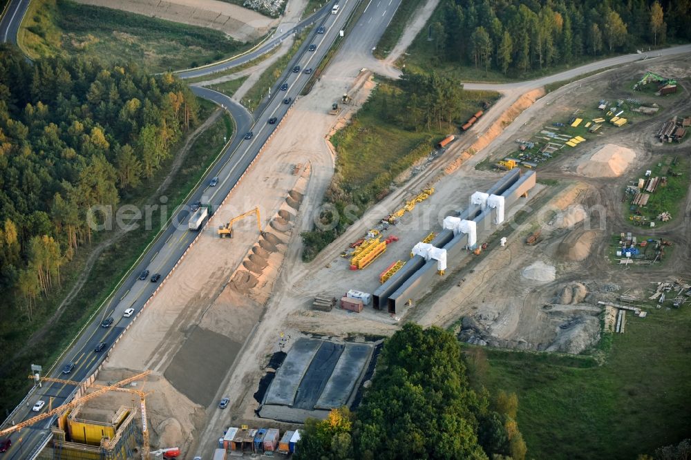 Petersdorf from the bird's eye view: Routing and traffic lanes over the highway bridge in the motorway A 19 and new construction site in Petersdorf in the state Mecklenburg - Western Pomerania