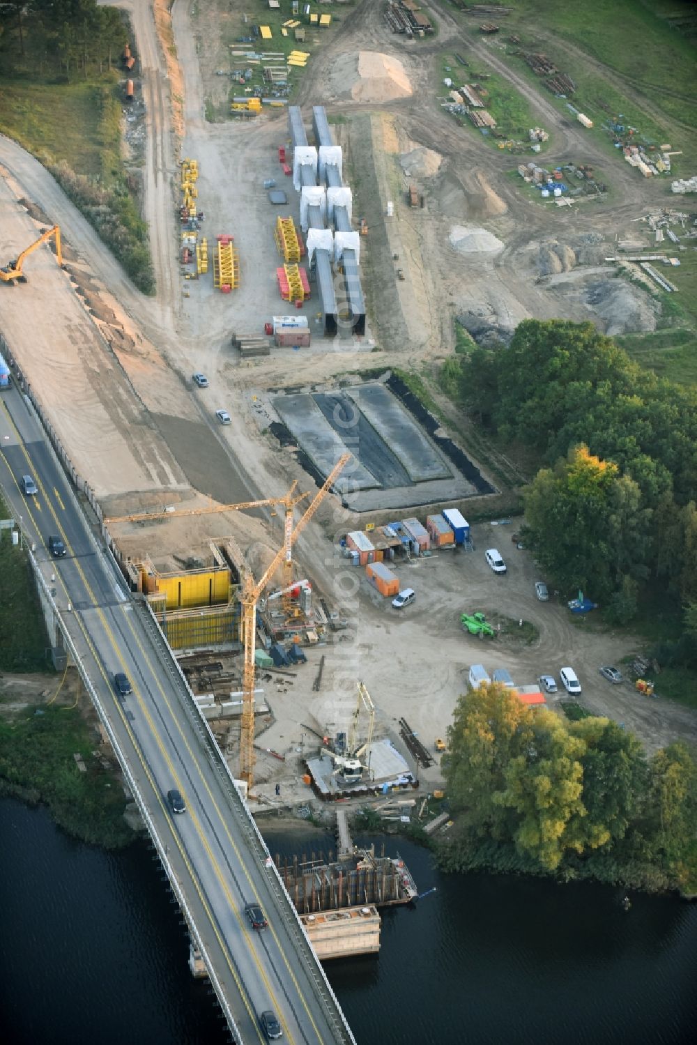 Petersdorf from the bird's eye view: Routing and traffic lanes over the highway bridge in the motorway A 19 and new construction site in Petersdorf in the state Mecklenburg - Western Pomerania