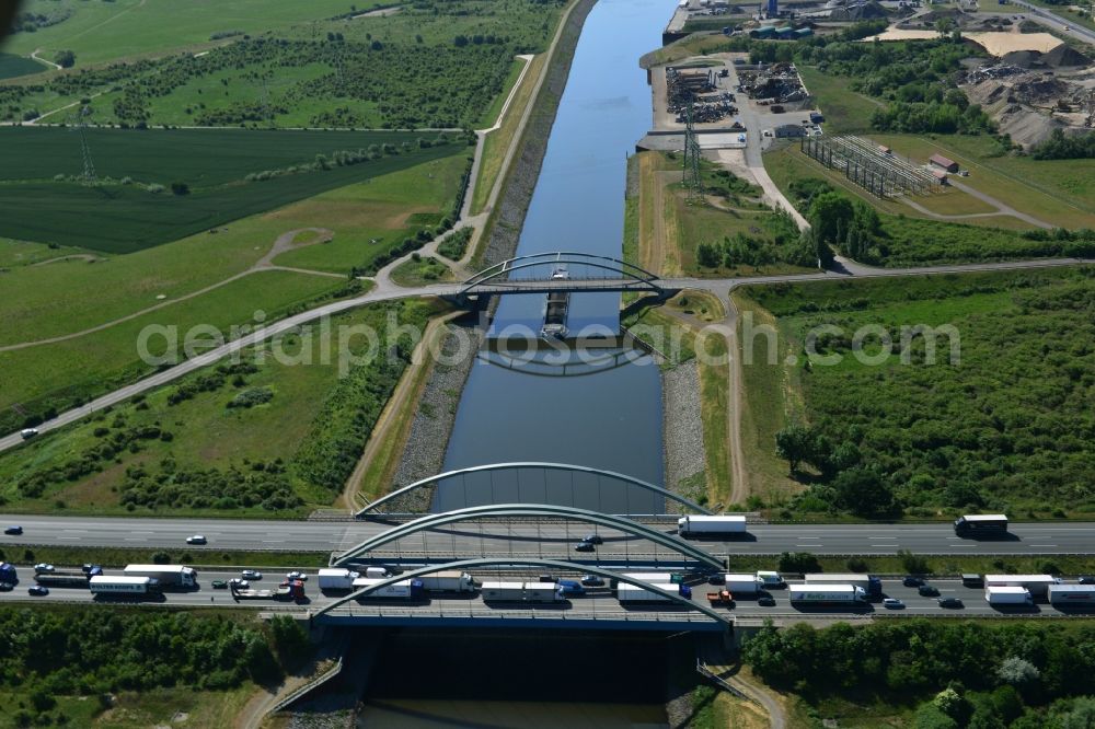 Aerial photograph Magdeburg - Routing and traffic lanes over the highway bridge in the motorway A 2 - E30 on the banks of Rothenseer descent channel in Magdeburg in the state Saxony-Anhalt