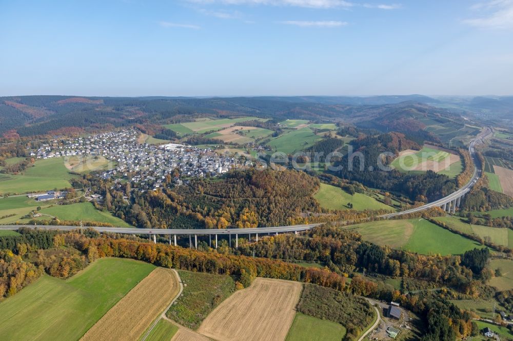 Eversberg from above - Routing and traffic lanes over the highway bridge in the motorway A 46 in Eversberg in the state North Rhine-Westphalia, Germany