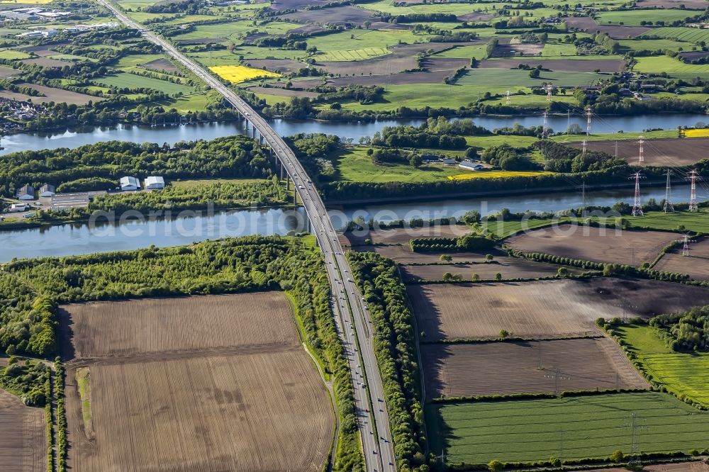 Rade from above - Routing and traffic lanes over the highway bridge in the motorway A 7 in Rade in the state Schleswig-Holstein, Germany