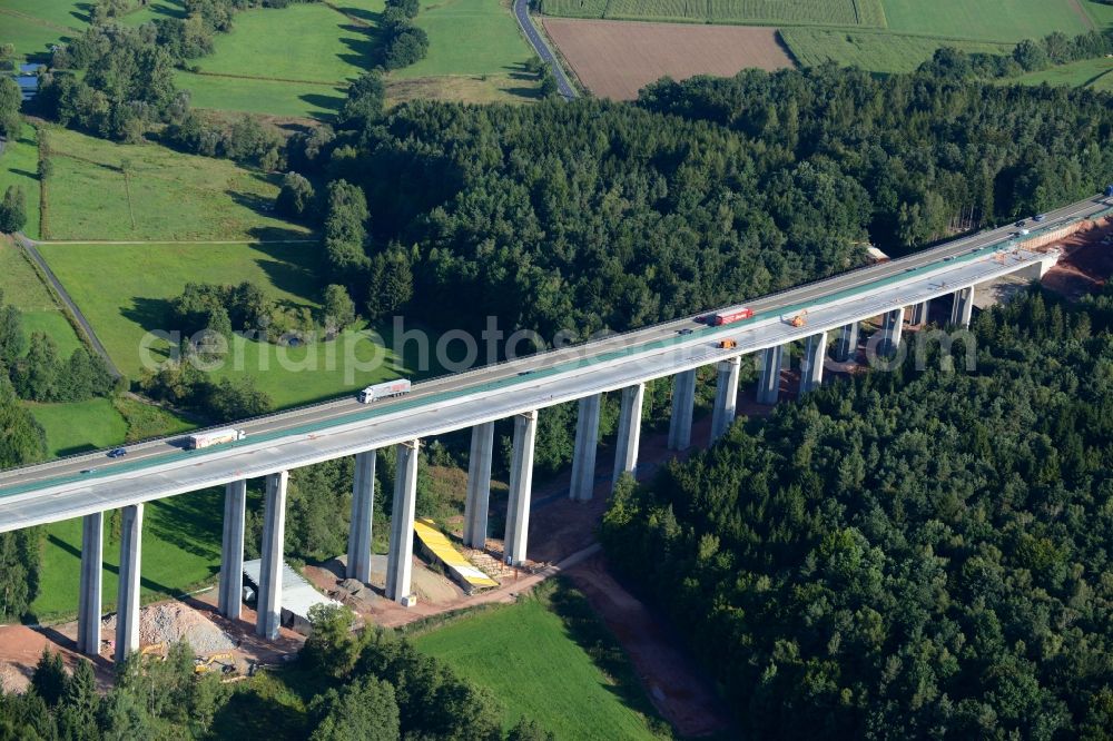 Ebersburg from the bird's eye view: Routing and traffic lanes over the highway bridge in the motorway A 7 E45 - Viadukt of Doellbachtalbruecke in Ebersburg in the state Hesse