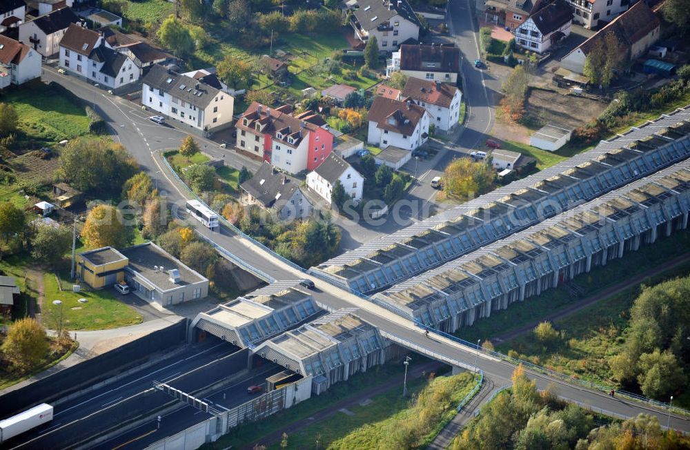 Goldbach from the bird's eye view: Die längste Photovoltaikanlage / Solaranlage der Welt befindet sich auf dem Dach der Autobahn-Einhausung der A 3 bei Aschaffenburg in Baden-Württemberg. Betreiber ist das Elektrizitätswerk Goldbach Hösbach. The world longest photovoltaic power plant / solar power system of the freeway E 41 is on the roof of the Motorway-enclosure near Aschaffenburg in Baden-Wuerttemberg.