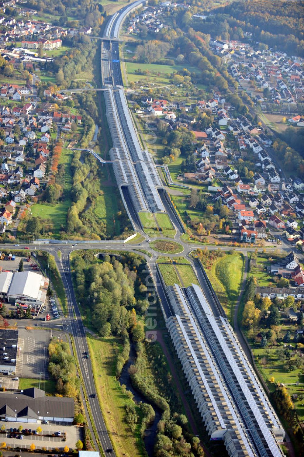 Aerial photograph Goldbach - Die längste Photovoltaikanlage / Solaranlage der Welt befindet sich auf dem Dach der Autobahn-Einhausung der A 3 bei Aschaffenburg in Baden-Württemberg. Betreiber ist das Elektrizitätswerk Goldbach Hösbach. The world longest photovoltaic power plant / solar power system of the freeway E 41 is on the roof of the Motorway-enclosure near Aschaffenburg in Baden-Wuerttemberg.