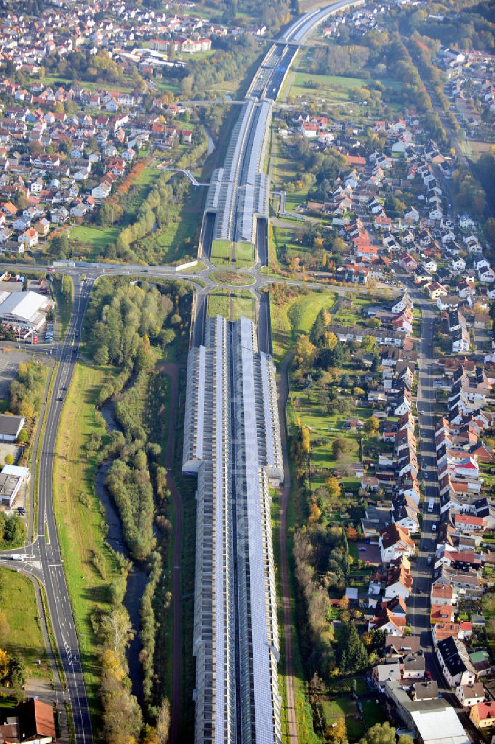 Aerial photograph Goldbach - Die längste Photovoltaikanlage / Solaranlage der Welt befindet sich auf dem Dach der Autobahn-Einhausung der A 3 bei Aschaffenburg in Baden-Württemberg. Betreiber ist das Elektrizitätswerk Goldbach Hösbach. The world longest photovoltaic power plant / solar power system of the freeway E 41 is on the roof of the Motorway-enclosure near Aschaffenburg in Baden-Wuerttemberg.